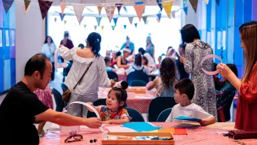 Children and parents in a creative art session at Sydney Opera House.